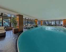 The hotel comprised of many modern amenities such as a fitness center which is on the top floor of the building. It also has a pool in a glass-enclose